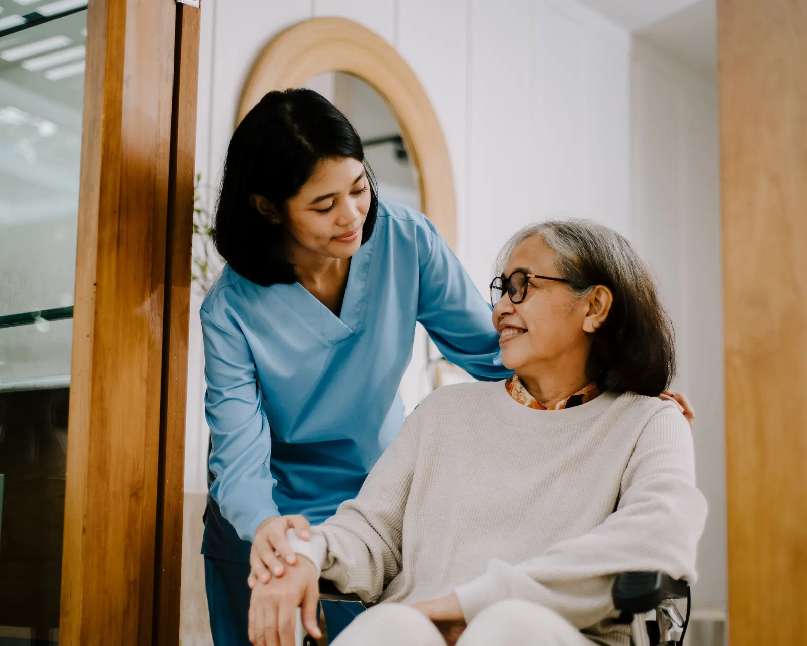 Caregiver offering companionship and support to an older adult at home